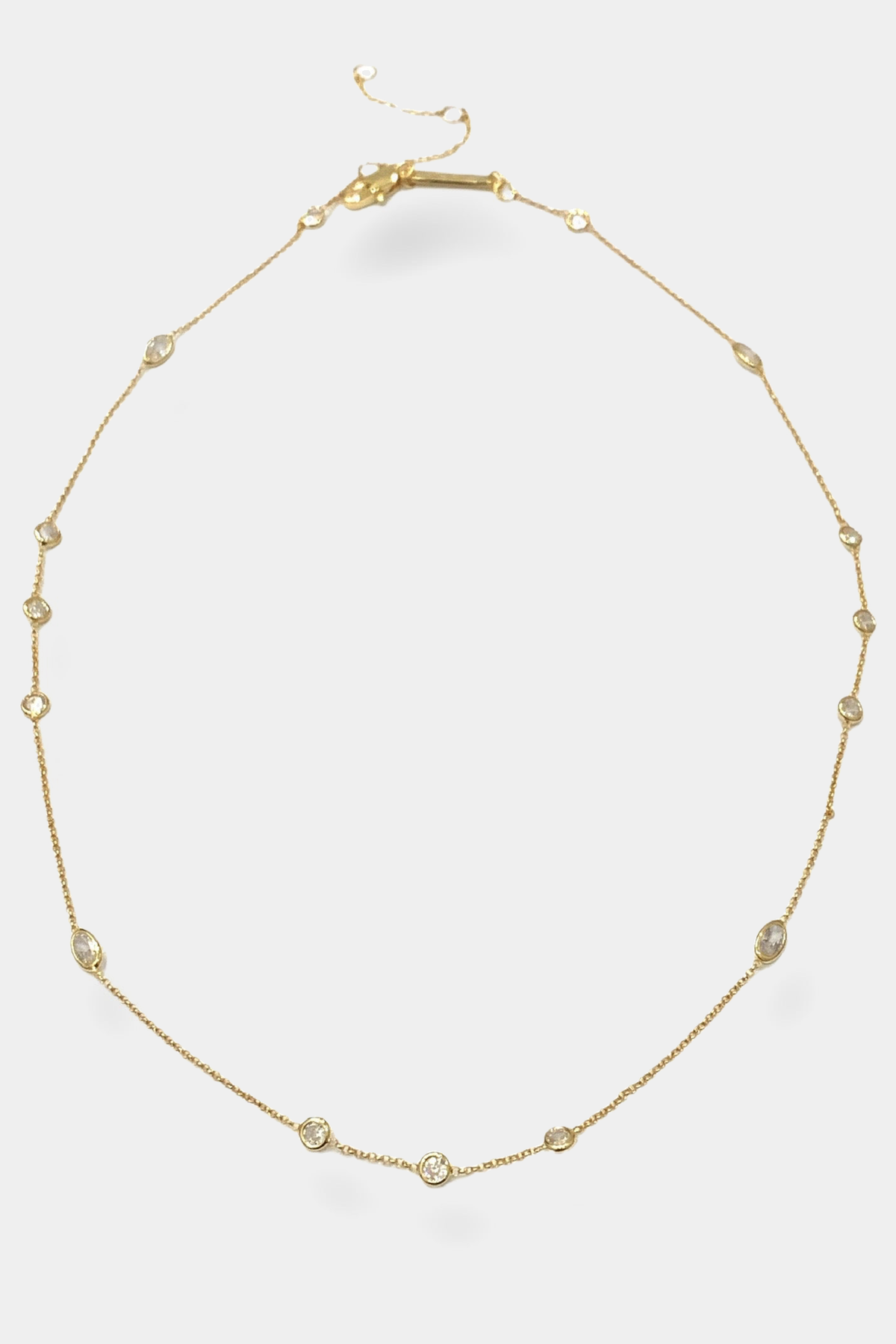 Harper Short Mixed Necklace 82318N0024 in Gold Finish, complete necklace with clasp and extension chain on light-gray background
